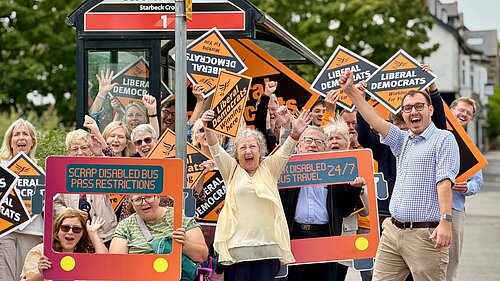 Tom Gordon MP celebrates with fellow campaigners