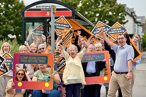 Tom Gordon MP celebrates with fellow campaigners